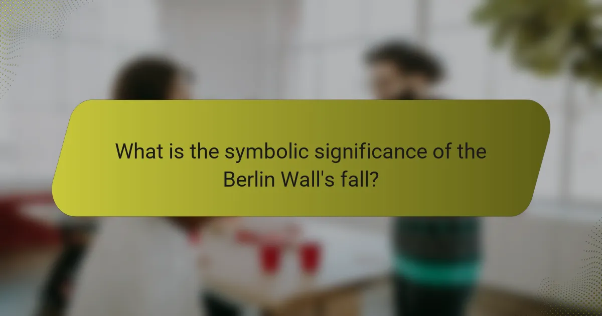 What is the symbolic significance of the Berlin Wall's fall?